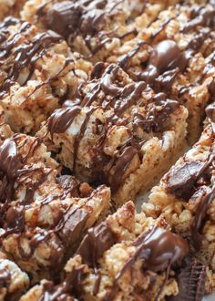 a close up of a dessert with chocolate drizzled on top