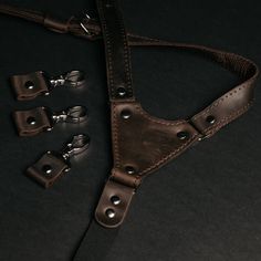 "Men's suspenders in different color variations are made from genuine quality leather and have a pattern with a rubber band on the back and length adjusters on the front. This construction has been worked out for years and brings an excellent fit and a comfortable wearing experience. You can order a set of suspenders and a leather bow tie and create a total look for the groom and groomsmen for a wedding, outfit for any party, or your beloved one. Please note that we are also working with bulk or Classic Belts And Suspenders With Adjustable Strap For Everyday, Brown Leather Belts And Suspenders For Everyday, Brown Leather Strap Belts And Suspenders, Everyday Brown Leather Belts And Suspenders, Adjustable Brown Belts And Suspenders For Everyday Use, Black Adjustable Belts And Suspenders For Everyday Use, Vintage Belts And Suspenders With Adjustable Straps, Black Leather Belts And Suspenders With Adjustable Strap, Classic Adjustable Belt With Leather Strap