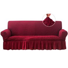 a red couch with a ruffled cover on it's back and an image of a