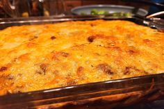 a casserole dish with meat and cheese in it