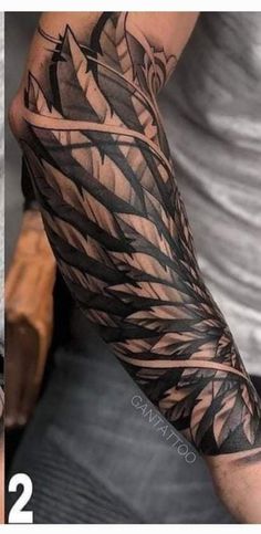 two different tattoos on the arms and arm, one is black and grey with leaves