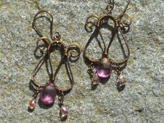 Bronze, pink quartz, and spinel earrings Pink Wire Wrapped Teardrop Earrings, Elegant Nickel-free Pink Chandelier Earrings, Elegant Pink Nickel-free Chandelier Earrings, Pink Wire Wrapped Jewelry For Jewelry Making, Handmade Pink Teardrop Crystal Earrings, Pink Teardrop Chandelier Earrings, Nickel Free, Pink Bohemian Jewelry With Ear Wire, Bohemian Pink Jewelry With Ear Wire, Pink Bohemian Crystal Earrings For Pierced Ears