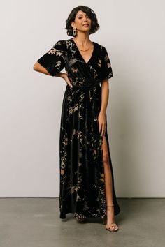 Say hello to our Uma Velvet Maxi Dress! This gorgeous dress features black velvet material with a unique burnout butterfly print. Floral Print Surplice Neckline Maxi Dress For Evening, Floral Print Wrap Dress For Party, Floral Print Wrap Party Dress, V-neck Floral Print Wrap Dress For Evening, Floral Print V-neck Evening Wrap Dress, Short Sleeve Wrap Dress With Tie Waist For Party, Short Sleeve Tie Waist Wrap Dress For Party, Party Wrap Dress With Tie Waist And Short Sleeves, Floral Print Maxi Wrap Dress For Party