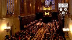 an overhead view of a large hall with people sitting in the pews and standing on the floor