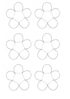 four flower shapes cut out from paper