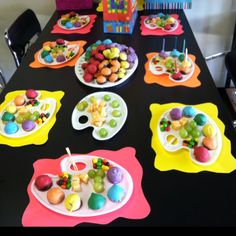 the table is set up with candy and candies for an easter egg hunt party