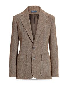 Elevate your wardrobe with the timeless sophistication of our Herringbone Blazer. Crafted with meticulous attention to detail, this blazer features notch lapels, a two-button front closure, and long sleeves with four-button cuffs for a classic, polished look. The distinct herringbone pattern adds a touch of modern flair, while the suede collar facing and shoulder pads provide a luxurious and structured feel. With flap hip pockets and a vent at the center back hem, this blazer seamlessly combines style and functionality. Whether you're headed to a business meeting or a special event, this blazer is the perfect choice for making a lasting impression. Designed and made in Portugal, the impeccable craftsmanship and quality construction ensure a standout addition to your wardrobe. Fully lined f Elegant Fitted Tweed Sport Coat, Classic Tweed Jacket With Herringbone Pattern, Classic Tailored Tweed Jacket With Herringbone Pattern, Formal Tweed Blazer With Herringbone Pattern, Tailored Tweed Sport Coat In Elegant Style, Tailored Elegant Tweed Sport Coat, Elegant Tailored Tweed Blazer, Luxury Tailored Tweed Jacket With Herringbone Pattern, Classic Formal Tweed Jacket With Herringbone Pattern