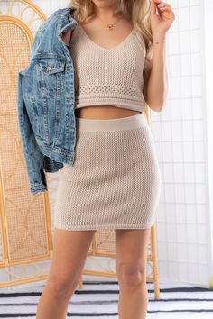 Get ready to fulfill your crochet dreams with the Z Supply Natural Carlita Crochet Mini Skirt ! This vintage-inspired skirt is the epitome of warm weather style. With its elasticized waistband, it offers a comfortable and flattering fit. Made from 100% cotton crochet knit, it combines both style and breathability. This mini skirt pairs perfectly with our Z Supply Natural Embrie Crochet Tank for the ultimate beach vacation look. Embrace the beauty of crochet and step out in style with this must-h Knit Mini Skirt For Summer, Summer Fitted Knit Skirt, Fitted Knit Skirt For Summer, Spring Knit Mini Skirt, Knit Mini Skirt For Spring, Casual Mini Length Crochet Top For Spring, Spring Fitted Knit Mini Skirt, Fitted Knit Mini Skirt For Spring, Casual Summer Skirt With Crochet Trim