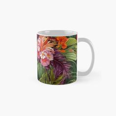 a colorful floral design on a coffee mug