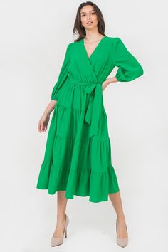 A solid midi dress featuring surplice neckline, 3/4 sleeve, elasticized waist with self sash belt Details Self 97% Polyester, 3% Spandex Lining: 100% Polyester Size & Fit - Model is 5`8" And Wearing Size Small - Measurements Taken From Size Small - Approx. Length: 46" Solid Midi Dress, Surplice Neckline, Sash Belts, Sash Belt, Green Midi Dress, Breathable Fabric, Fitness Models, Night Out, Elastic Waist