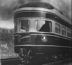 an old black and white photo of a train