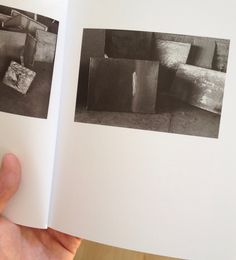 an open book with black and white photographs