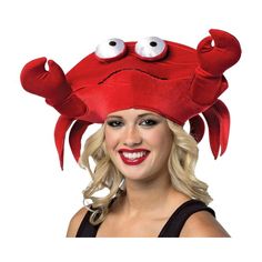 a woman wearing a red crab hat with googly eyes on her head and blonde hair