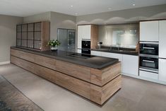 a modern kitchen with an island counter top