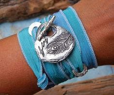 Concert Jewelry, Music Festival Accessories, Music Fest Style Bracelet, Festival Bracelet, Music Fes Music Festival Accessories, Silver Wrap Bracelet, Silk Wrap Bracelets, Wrap Armband, Peacock Jewelry, Feather Fashion, Hand Dyed Silk Ribbon, Mode Hippie, Feather Bracelet