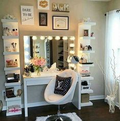 a white chair sitting in front of a mirror on top of a dresser next to a window