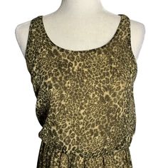 Leopard Print High Low Hem Mini Dress M Brown Sleeveless Elastic Waist LinedExcellent conditionChest: 18" laying flatWaist: 13" laying flat, unstretchedLength: 35" shoulder to hem in front, 45" in backNo fabric tagsMade in Vietnam Flowy Sleeveless Beach Dress, Casual Flowy Sleeveless Tank Top, Stretch Sleeveless Sundress, High Low Hem, High & Low, High Low, Leopard Print, Vietnam, Elastic Waist