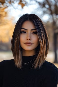 a woman with long brown hair wearing a black turtle neck sweater and choker necklace