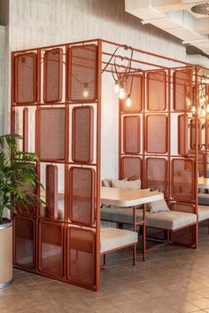 a room divider with chairs and tables in it