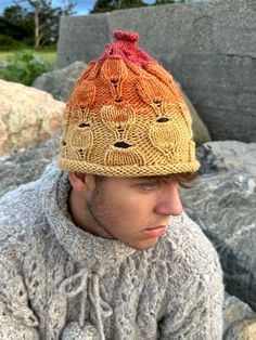 Seamless knitted hat, made with wool blend yarn and very cool pattern.  Bright colors from yellow, orange to red are made this hat is fun and keep you in a good mood whole day! Wonderful gift for those who love colors and unusual designs. We are using limited stack of a high quality yarn from European and US companies. As soon as the current yarns runs out, all products will be discontinued.  Please do not miss the chance to purchase. Popular Now, Unusual Design, Knitted Hat, Skull Cap Beanie, Trendy Gift, Lace Knitting, Skull Cap, Cool Patterns, Yellow Orange