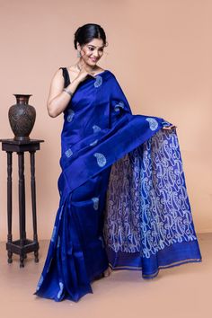 It's a minimalistic-looking silk block print. There are two types of Kalka block printing present in the saree. The anchal has abstract and contemporary Kalka motifs. Also, the body has a very traditional Kalka motif. This blue silk saree has almost become synonymous with your perfect evening wear. This mulberry silk is intricately designed in a combination with traditional and abstract paisley block prints. Like all of our sarees, this saree is also silk mark certified. Hence, you don't have to Blue Traditional Pre-draped Saree With Kalamkari Print, Traditional Blue Pre-draped Saree With Kalamkari Print, Festive Blue Cotton Silk Pre-draped Saree, Woo Man, Blue Bollywood Tussar Silk Pre-draped Saree, Luxury Blue Tussar Silk Pre-draped Saree, Blue Silk Saree, Wardrobe Makeover, Shiny Fabric