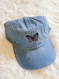 Stay cool + on trend in this adorable denim baseball cap! Denim fabric with embroidered butterfly Adjustable back Spring Cotton Trucker Hat With Flat Bill, Casual Snapback Hat With Embroidered Patch, Casual Cotton Hat With Embroidered Patch, Denim Snapback Baseball Cap For Streetwear, Trendy Cotton Baseball Cap With Flat Bill, Casual Dad Hat With Embroidered Patch, Trendy Denim Snapback Baseball Cap, Trendy Embroidered Cotton Snapback Hat, Trendy Blue Trucker Hat