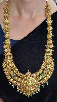 22 karat gold "lakshmi - peacock" long necklace with color stones, pearls & beads (temple jewellery)

  exude elegance with our 22 karat gold "lakshmi - peacock" long necklace  indulge in the rich cultural heritage of india with our exquisite 22 karat gold "lakshmi - peacock" long necklace. handcrafted with intricate detailing, this stunning piece features colorful stones, pearls, and beads that add a touch of glamour to any outfit. the temple jewellery design exudes traditional charm, Cultural Heritage Of India, Toes Ring Silver, 22k Gold Bangles, Baby Gold Rings, Temple Jewelry Necklace, Gold Initial Pendant, Gold Temple Jewellery, Diamond Earrings For Women, Colorful Stones