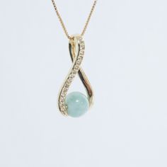 Discover the serene beauty of the Caribbean with our handcrafted Larimar pendant necklace. Each piece features a unique, ethereal blue stone, known for its calming properties, delicately set on a high-quality Gold filled chain. This elegant accessory adds a touch of sophistication to any outfit, making it perfect for both casual and formal wear. Larimar, a rare gemstone found only in the Dominican Republic, is renowned for its striking color and soothing energy. Our necklace is crafted with care Elegant Round Amazonite Necklace, Elegant Jade Pendant Crystal Necklace, Elegant Jade Crystal Necklace As Gift, Elegant Jade Crystal Necklace For Gift, Elegant Amazonite Jewelry Gift, Elegant Amazonite Jewelry For Gifts, Elegant Round Aquamarine Necklace, Larimar Gemstone Pendant Necklaces, Larimar Gemstone Pendant Necklace