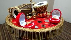 a table topped with lots of red and gold items