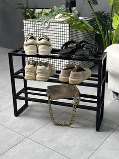 several pairs of shoes are sitting on a shoe rack