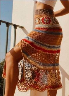 a woman wearing a skirt made out of crochet