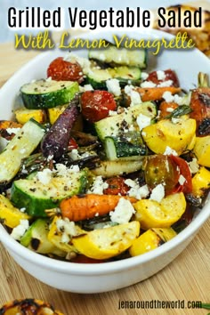 grilled vegetable salad with lemon vinaiette and feta cheese in a white bowl