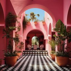 an indoor courtyard with potted plants and checkered flooring