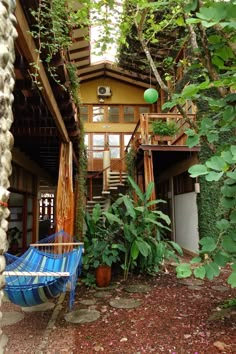 a blue chair sitting in front of a house