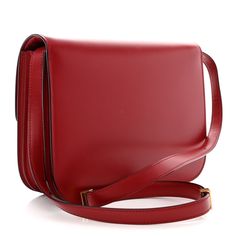 This is an authentic CELINE Box Calfskin Medium Classic Box Flap Bag in Red. This chic shoulder bag is crafted of luxuriously smooth deep red box calfskin leather in the medium size. The bag features a waist-length shoulder strap and a facing flap with a gold switch-lock. The flap opens to a partitioned leather interior with pockets. Celine Box, Flap Bag, Waist Length, Leather Interior, Deep Red, Medium Size, Calf Skin, Shoulder Strap, Shoulder Bag