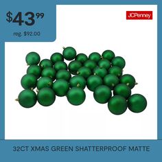 a pile of green christmas balls sitting on top of each other