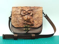 3D Owl Figure Genuine Leather Bag This unique and stylish bag is meticulously handcrafted using premium vegetable-tanned leather. The standout feature of this bag is the 3D owl figure on the flap, which is created using traditional leatherworking techniques and hand-painted to achieve a vintage look. Material and Craftsmanship: Premium Leather: Made from high-quality vegetable-tanned leather, ensuring durability and a beautiful patina over time. Handcrafted 3D Owl Figure: The owl figure on the f Rectangular Embossed Shoulder Bag For Gift, Rectangular Embossed Shoulder Bag As Gift, Rectangular Bags With Leather Strap For Gift, Rectangular Bag With Leather Strap For Gift, Rectangular Bag With Leather Strap As Gift, Gift Leather Shoulder Bag With Leather Strap, Gift Embossed Satchel Shoulder Bag, Leather Shoulder Bag With Leather Strap As Gift, Brown Leather Strap Shoulder Bag As Gift