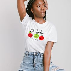 How cute is this apple shirt designed for teachers in mind. whether it's a back to school shirt or a gift for a teacher, this shirt will make a great addition to everyone's wardrobe. All items are made to order and will ship within a week from one of Printing Partners. Please allow for sufficient time for production and shipping, especially during busy seasons/holidays.  Please review your order before purchasing as we do not accept returns unless there is proof of damage of the product upon arr Trendy Teacher Appreciation T-shirt For Back To School, Funny Teacher Appreciation T-shirt For Back To School, Funny T-shirt For Teacher Appreciation And Back To School, Cute Fitted T-shirt For School, Casual Teacher Appreciation T-shirt For Back To School, Cotton T-shirt For Teaching, Back To School, Apple Shirt, Apple Teacher, Teacher Apple