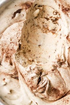 a bowl filled with whipped cream and cinnamon