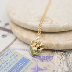 🎉Dainty enamel lily of the valley pendant necklace 🎉Design and handcraft in our Burlington Studio ------------------------------------------------------------- PRODUCTS DETAILS Pendant: 15X12mm Pendant: 14K gold plated enamel Chain and findings: 14K gold filled Chain length: 16"/18"/20"/22" available from drop-down list, other length pls leave me a message for customization Model: 18" chain ------------------------------------------------------------- SAME COLLECTION Earrings https://www.etsy. Wedding Pendant Necklace In Enamel, Yellow Gold Enamel Necklace For Wedding, Gold Enamel Necklace For Wedding, Lily Of The Valley Necklace, Lily Of The Valley Jewelry, Jewelry Bride, Hydrangea Not Blooming, Jewelry Accessories Ideas, Wedding Party Jewelry