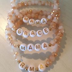 Glass Peach/White beaded bracelet accented with gold-filled spacer beads and gold letter beads. Letter beads can be customized to say any word, name or date. *Price is for ONE glass peach beaded bracelet Message your name/word/date or initials. EXAMPLE: MAGGIE .MAGGIE. M.G.A. 1.21.14 - Use a period if you want a bead spacer J.(heart).M J(heart)M - Do not use a period if you do not want a bead spacer Gold Heishi Beads Bracelets With 8mm Beads, Mother's Day Beaded Stretch Bracelet With Round Beads, Beaded Stretch Bracelet For Mother's Day, Stretch Beaded Bracelet For Mother's Day, Gold Letter Beads For Everyday Use, Gold Beaded Stretch Bracelet For Mother's Day, Spiritual Beaded Name Bracelet With Round Beads, Spiritual Beaded Name Bracelet, Gold Beaded Bracelets With Round Beads For Mother's Day