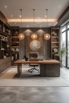 an office with wooden shelves and lights hanging from the ceiling, along with a large desk