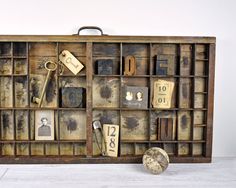 an old wooden box filled with lots of assorted items