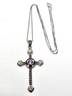 Amethyst and Marcasite SU sterling silver vintage cross pendant necklace. Good vintage condition with little to no signs of normal wear. Stamped on the back SU 925. Acid tests positive for sterling silver. Gemstones tested with Presidium II gemstone tester. Necklace measures 16 inches long. Pendant measures 2 and 1/8th of an inch tall and 1 and 1/8th of an inch wide. Vintage Sterling Silver Cross Pendant Necklace, Antique Sterling Silver Cross Pendant Necklace, Spiritual 925 Stamped Crucifix Necklace, Spiritual Crucifix Necklace Stamped 925, Long Pendant, Cross Pendant Necklace, Cross Pendant, Amethyst, Pendant Necklace