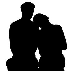 two people sitting next to each other in silhouette