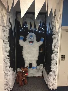 an ice monster and a stuffed animal in front of a door