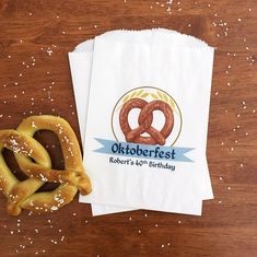 two pretzels sitting on top of each other next to a napkin with the oktoberfest logo