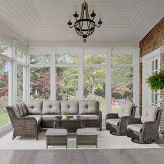 a living room filled with furniture and windows