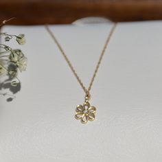 "Tiny Flower Diamond Necklace, Floral Dainty Necklace Gold 14K Solid , Nature Jewelry, Minimalist Solid Gold Charm Necklace, Gift for Her Diamond Flower Necklace with 14k solid gold chain. Tiny pendant is set with genuine natural round brilliant diamonds. Both the pendant and chain weigh a total of 1.00 gr. ▶ Product Details ○ Diamond: 100% Natural Diamond ○ Diamond Weight: 0.01 CTW ○ Pendant Size: 5 x 5 mm ○ Color: G Color ○ Clarity: VS-SI ○ Cut: Brilliant Cut ○ Metal: 14K Solid Yellow Gold ○ G Gold Flower Shaped Necklace For Everyday, Dainty Yellow Gold Necklace With Flower Charm, Yellow Gold Delicate Chain Pendant Necklace, Delicate 14k Gold Flower Pendant Necklace, Minimalist Yellow Gold Necklace With Flower Charm, Dainty White Gold Flower Necklace, Dainty 14k Gold Flower Pendant Necklace, Dainty Yellow Gold Necklace With Flower Pendant, Dainty 14k Gold Flower Necklace