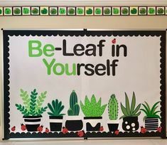 a bulletin board that says be - leaf in yourself with cactuses and succulents